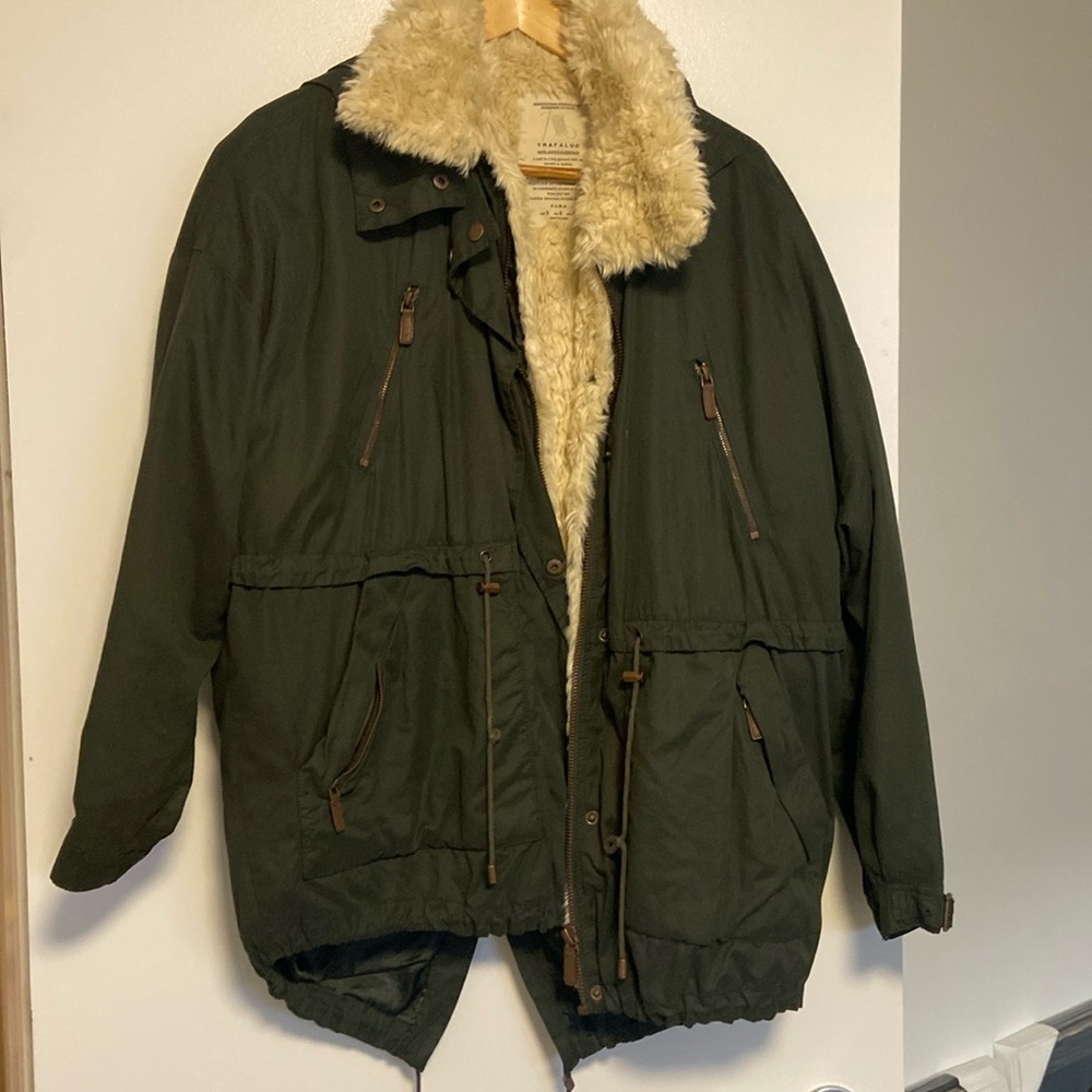 Army-green oversized hooded jacket with removable faux fur lining